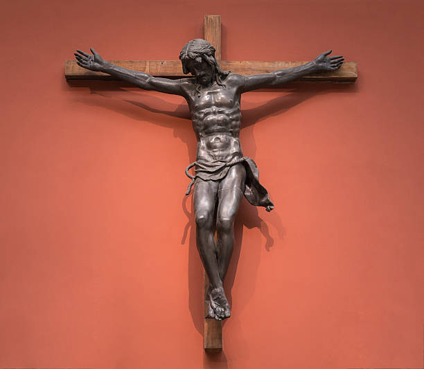 istock Cross of Jesus Christ on wall 515920202