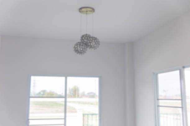 istock lamp hanging on the ceiling with door background (blurry defocus 515920570