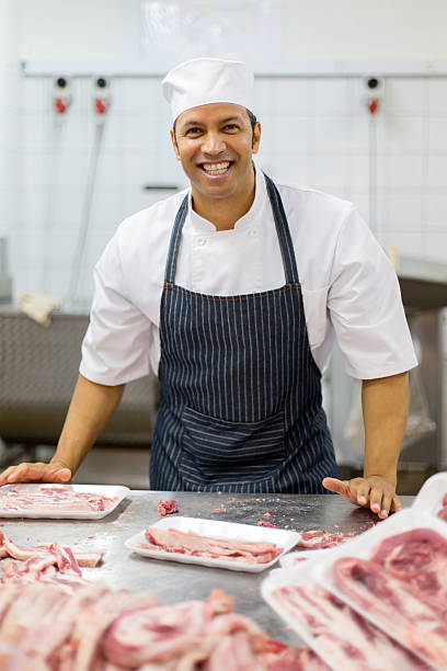 istock middle aged man working in butcher-shop 515921014