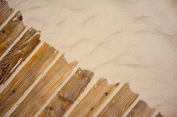 Photo of Sand on planked wood