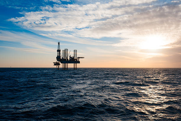 istock Silhouette of drilling rig at sunset 515923098