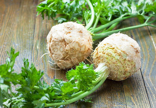 Fresh celery Two fresh celery on wooden table Celeriac stock pictures, royalty-free photos & images