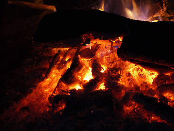 istock macrofilming the burning fire coals at night outdoors 515923732
