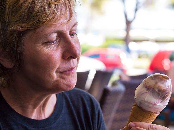 istock Woman having Ice Cream in open air restaurant 515924372