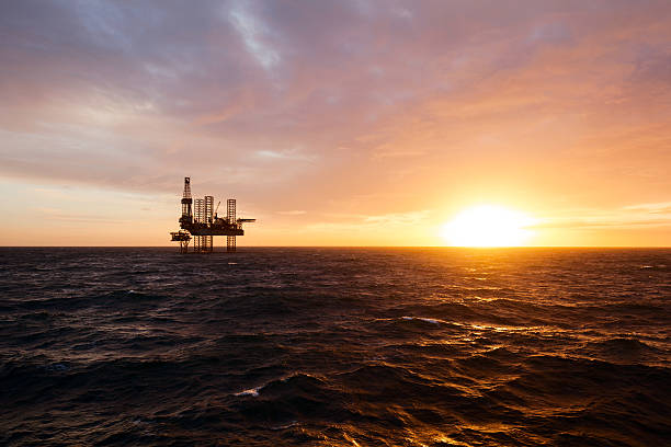 istock Silhouette of drilling rig at sunset 515924876