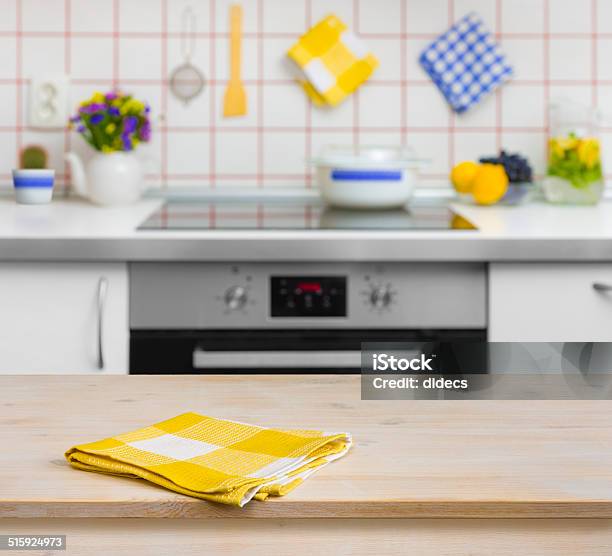 Wooden Table With Yellow Napkin On Kitchen Background Stock Photo - Download Image Now