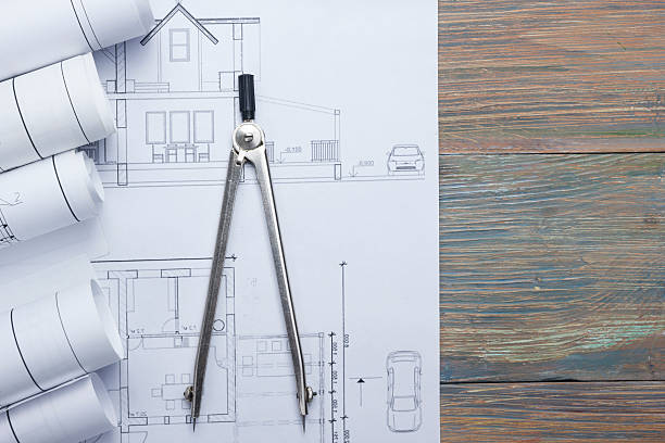 istock Architect worplace top view. Architectural project, blueprints, blueprint rolls and 515924990