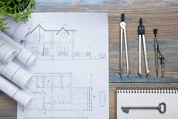 istock Real Estate concept. Architectural project, blueprints, blueprint rolls and  divider 515925320