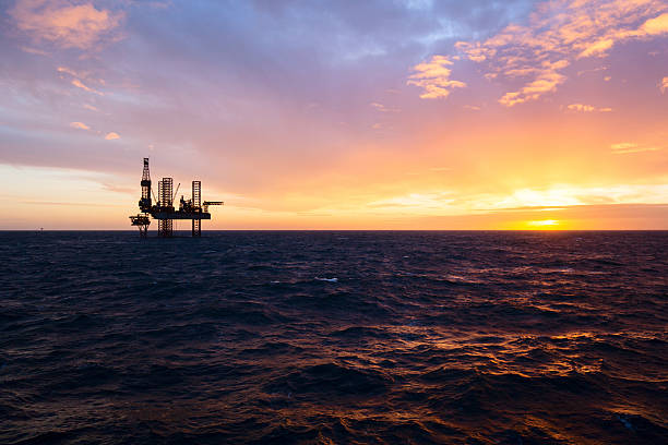 istock Silhouette of drilling rig at sunset 515925346