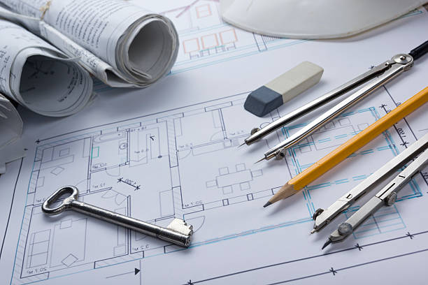 istock Architect worplace top view. Architectural project, blueprints, blueprint rolls and 515926638