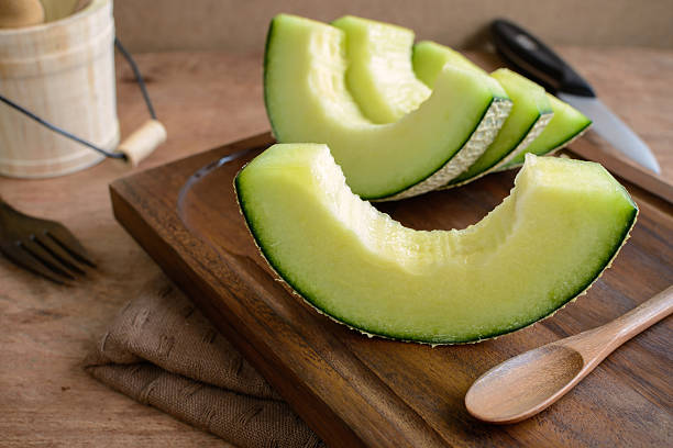 istock Juicy slice melon on a wooden table 515926990