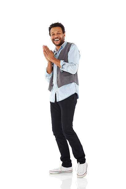 Cheerful african man on white Full length image of cheerful african man standing over white background whole stock pictures, royalty-free photos & images