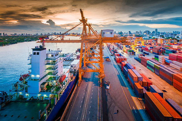 istock Cargo ship in the harbor at sunset . 515927245