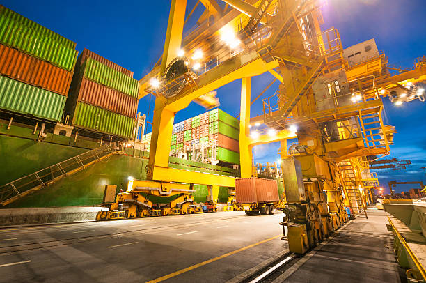 istock Cargo ship in the harbor at sunset . 515927283