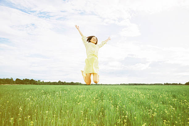 istock Happy woman in summer meadow 515930813