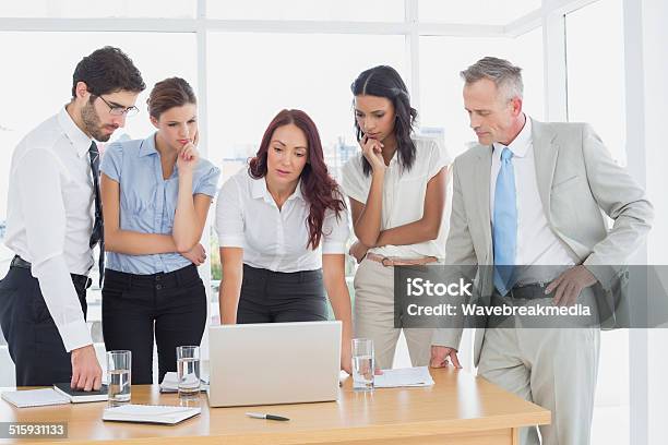 Business Team Discussing Work Details Stock Photo - Download Image Now - 18-19 Years, 20-29 Years, 25-29 Years