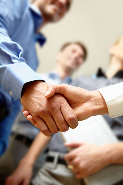 Deal Image of business handshake after signing new contract diplomacy photos stock pictures, royalty-free photos & images