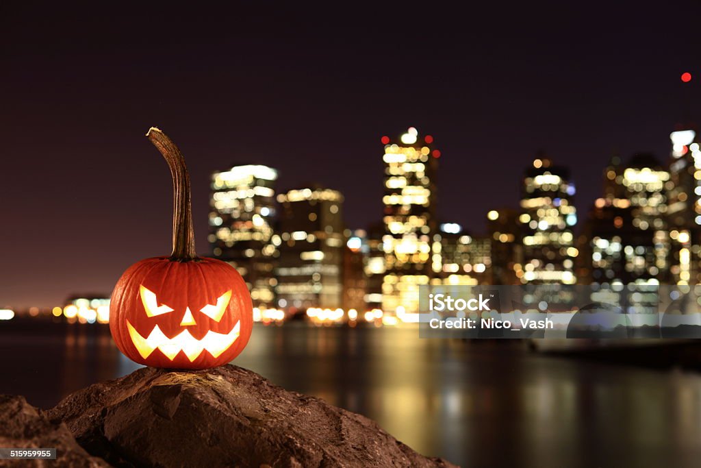 Symbol of Halloween Scary pumpkin, symbol of Halloween, waiting for a celebrate on the shores of Brooklyn, against Manhattan Island, New York, United States Halloween Stock Photo