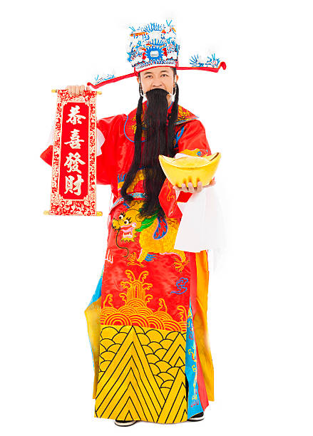 dio della ricchezza tenendo un mulinello congratulazioni e oro lingotto. - chinese god foto e immagini stock