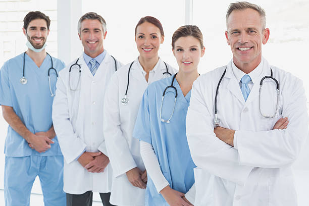 istock Smiling doctors all standing together 515960523