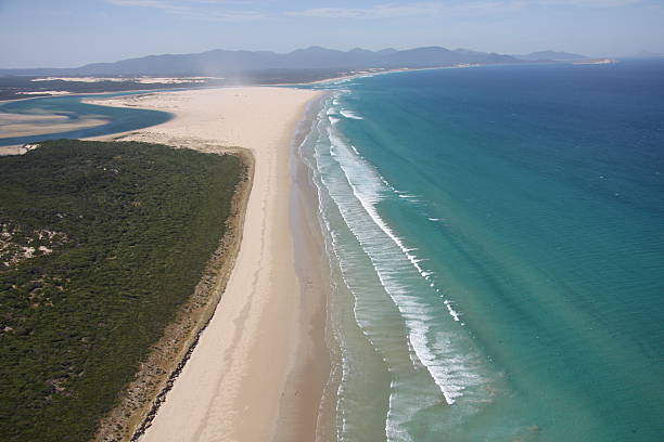istock Aerial view of ocean waves and beach 515961133