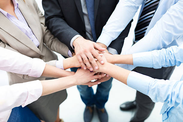 istock Business people joining hands in circle 515961369