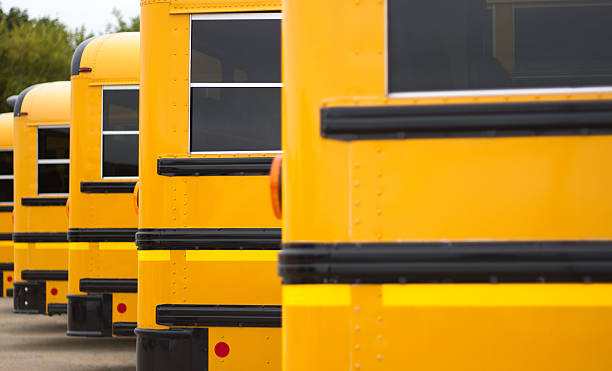 Line of Yellow School busses (Close-Up)