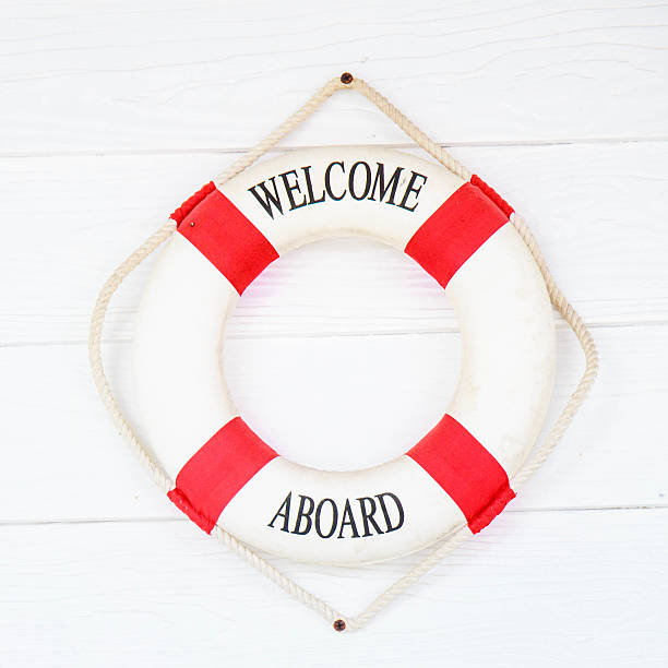 istock White Life buoy with welcome aboard on white wall 515962959