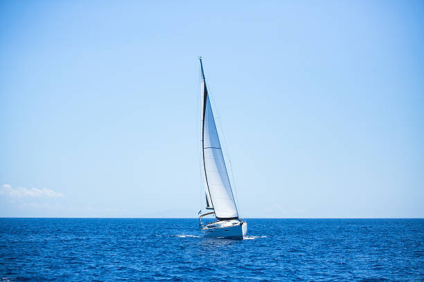 istock Lonely sailboat in the open sea. Romantic trip. 515963787