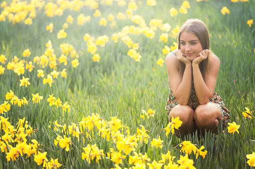 young woman with daffodils