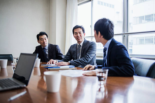 istock Three businessmen meeting in a conference room. 515963874