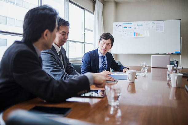 istock Three businessmen meeting in a conference room. 515964020