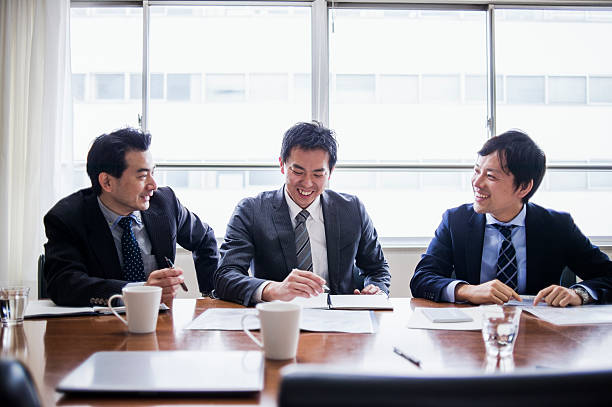 istock Three businessmen meeting in a conference room. 515965098