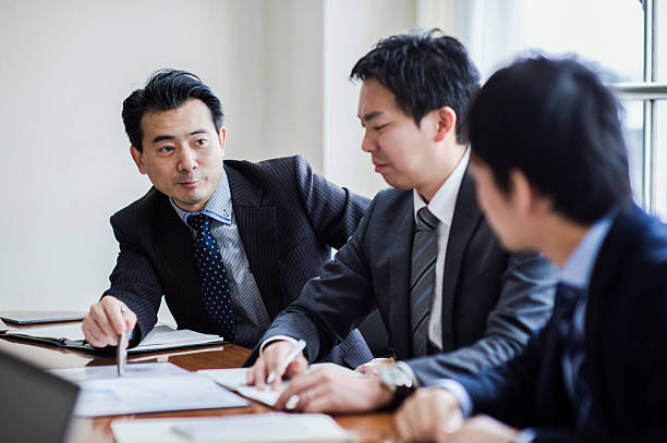 istock Three businessmen meeting in a conference room. 515965186