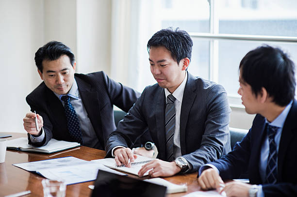 istock Three businessmen meeting in a conference room. 515965270