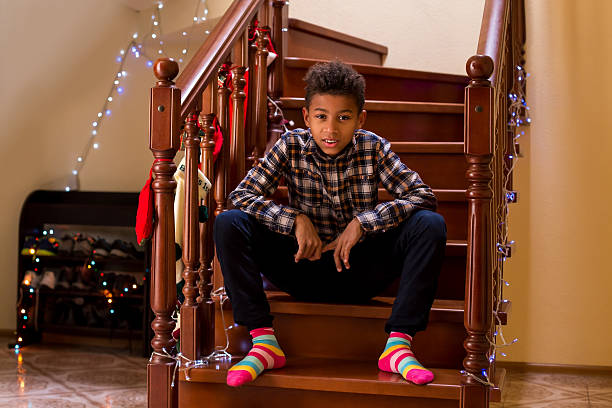 istock Mixed race boy in colorful socks. 515965558