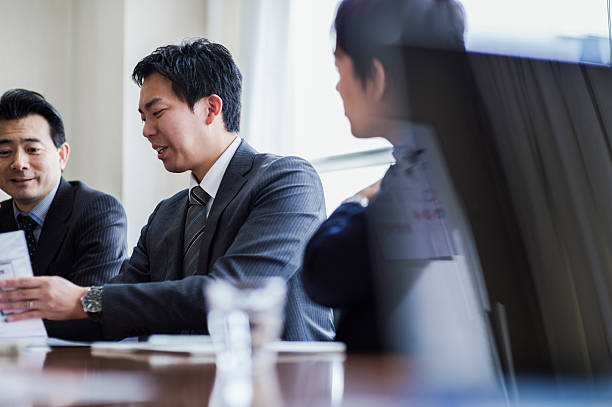 istock Three businessmen meeting in a conference room. 515965898