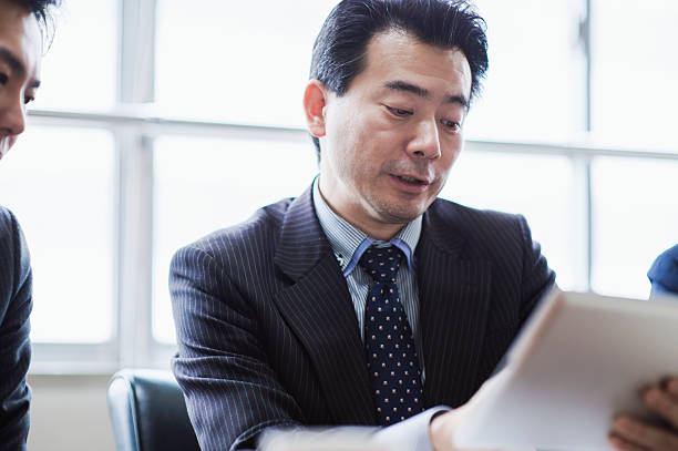 istock Businessmen meeting using digital tablet in a conference room. 515966140