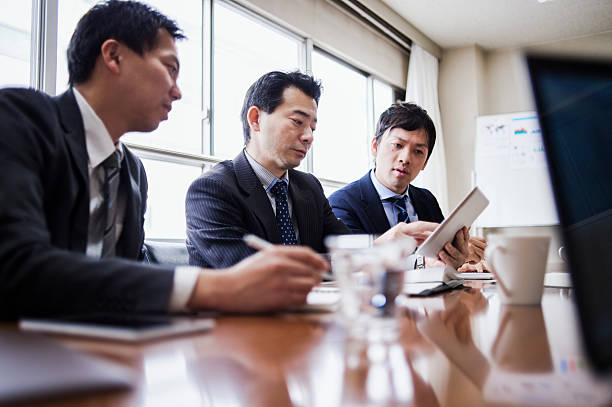 istock Three businessmen meeting in a conference room. 515966312