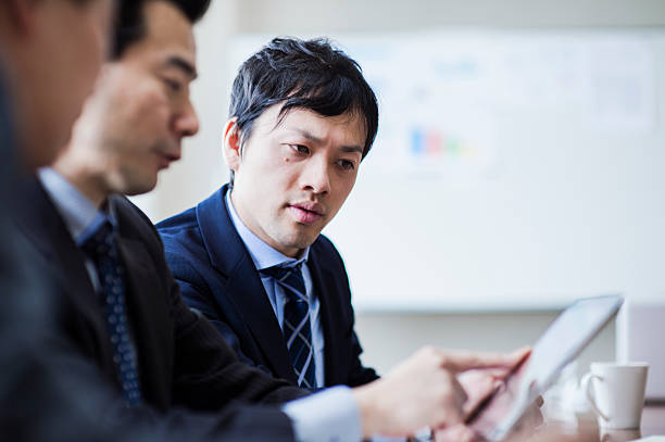 istock Three businessmen meeting in a conference room. 515966828