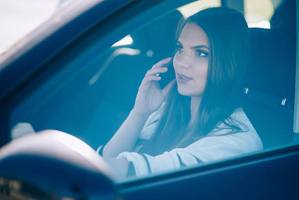 istock Young woman is driving a car in summer 515967048
