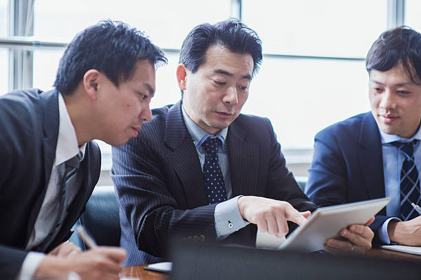 istock Three businessmen meeting in a conference room. 515967066