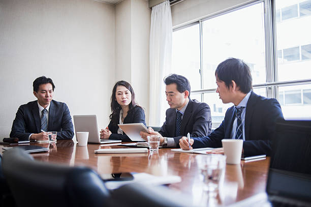 istock Four businesspeople meeting in a conference room. 515967572
