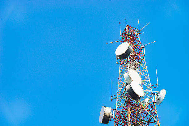 istock Telecommunication mast TV antennas with blue sky 515967688