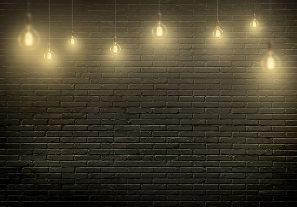 istock Hanging bulbs. Free space for text, wall in background. 515968154
