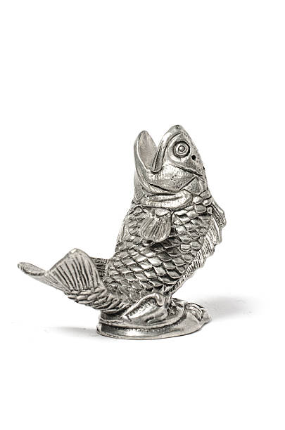 istock silver statuette of fish isolated on white 515969274