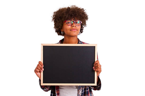 istock girl with blackboard 515970474