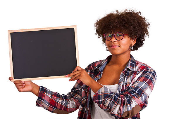 istock girl with blackboard 515970836