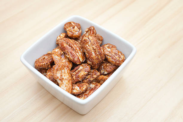 istock Pecan nuts coated in browned, crunchy sugar. 515970902