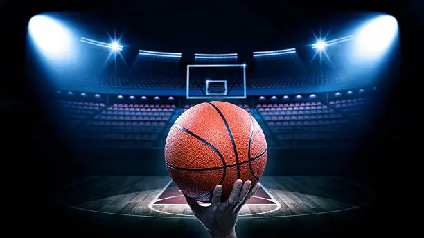 Photo of Basketball arena with player